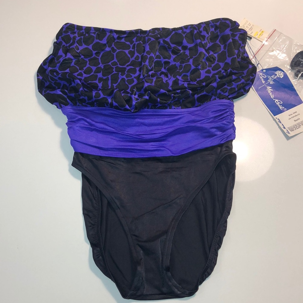 NWT purple/black one piece. Size 14.